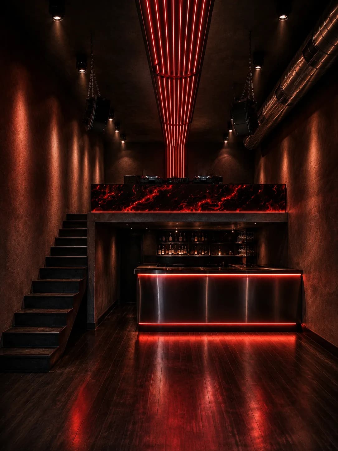 The elevated DJ booth at THEORY, backed by a red marble face.